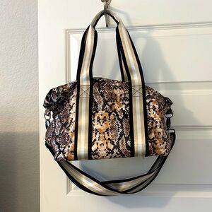 Think Royln Snake Print Tote Bag Black and Tan crossbody strap overnight bag